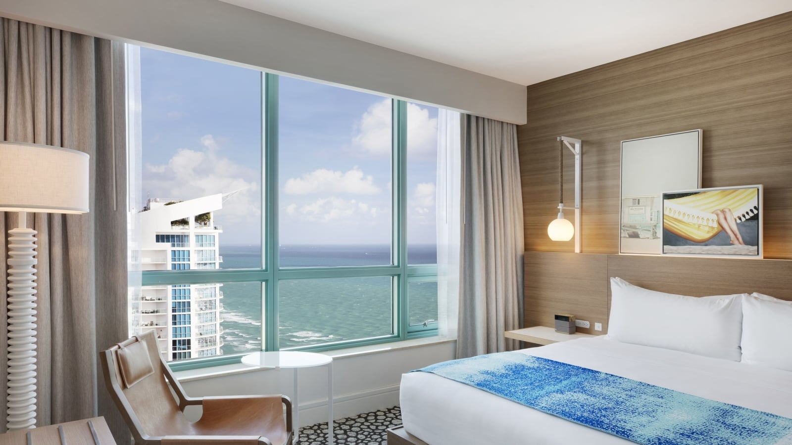 Diplomat Suite Bedroom with a view of the ocean from the bed