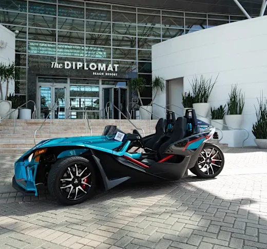 Slingshot vehicle parked out front of the Diplomat Resort