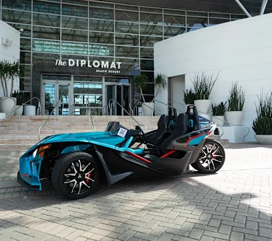 Slingshot vehicle parked out front of the Diplomat Resort