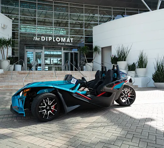 Slingshot vehicle parked out front of the Diplomat Resort