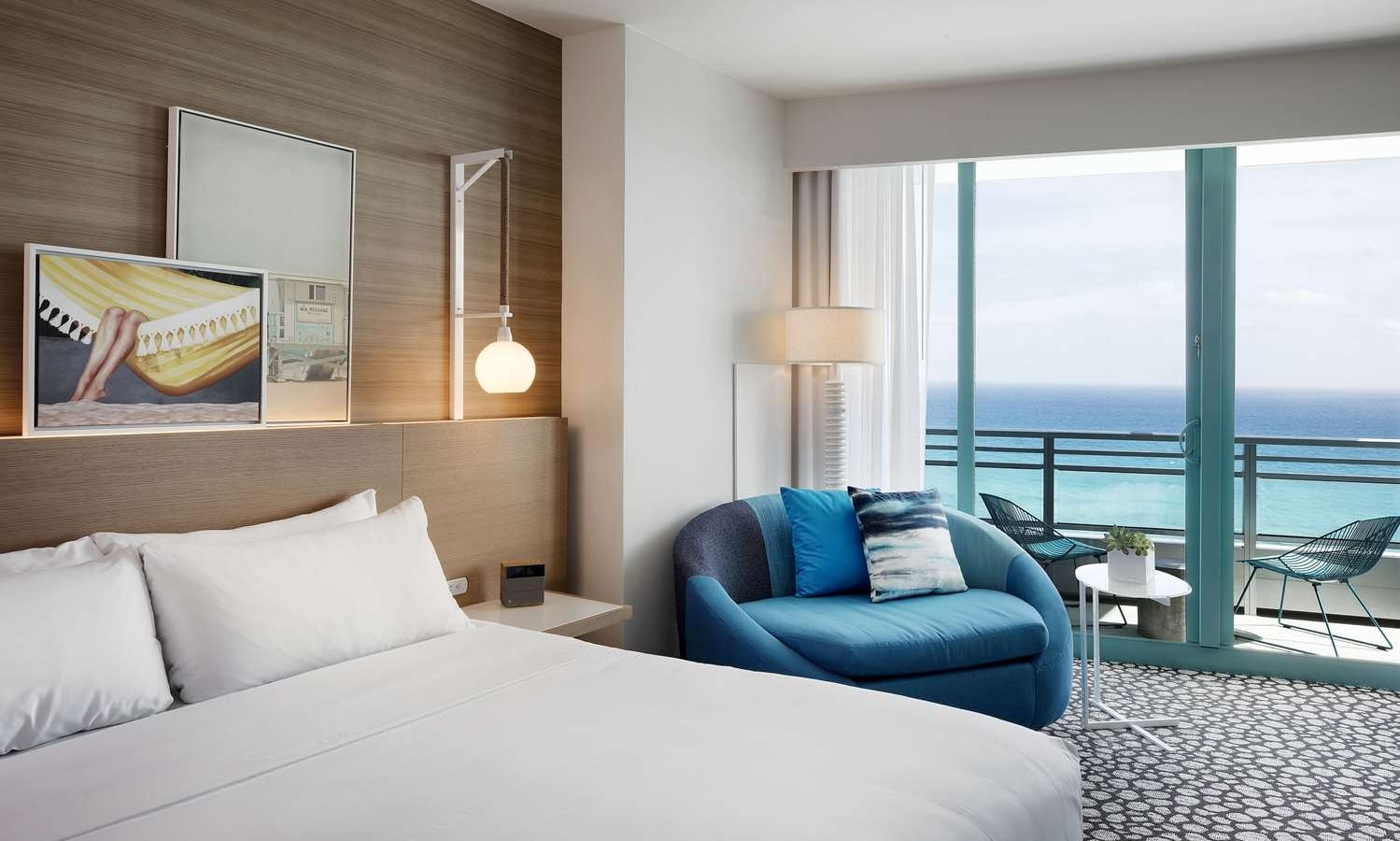 Grand King Oceanfront Bedroom with views of the outdoor patio and ocean beyond