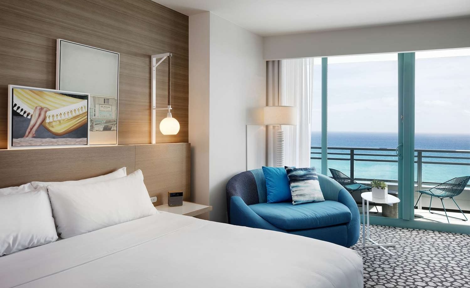 Grand King Oceanfront Bedroom with views of the outdoor patio and ocean beyond