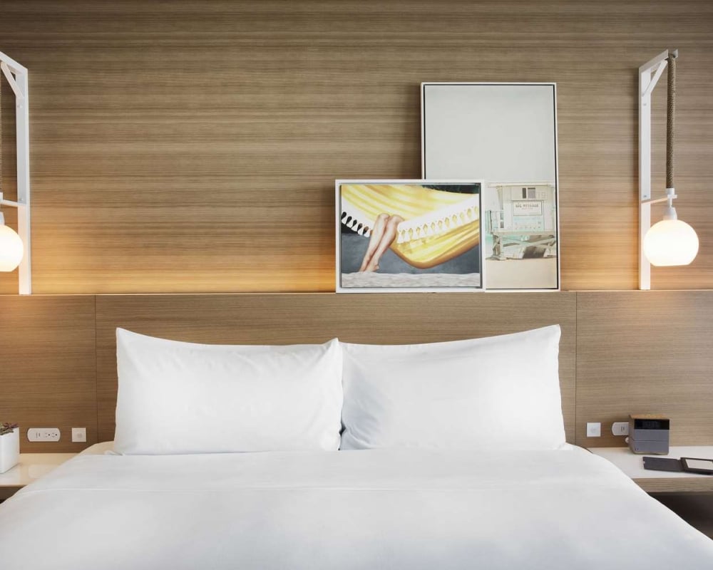 Sunrise King room with hanging pendant lights and modern art decor