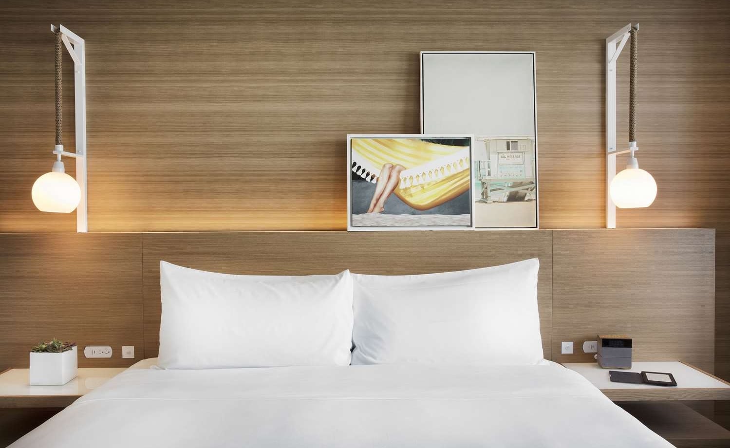 Sunrise King room with hanging pendant lights and modern art decor