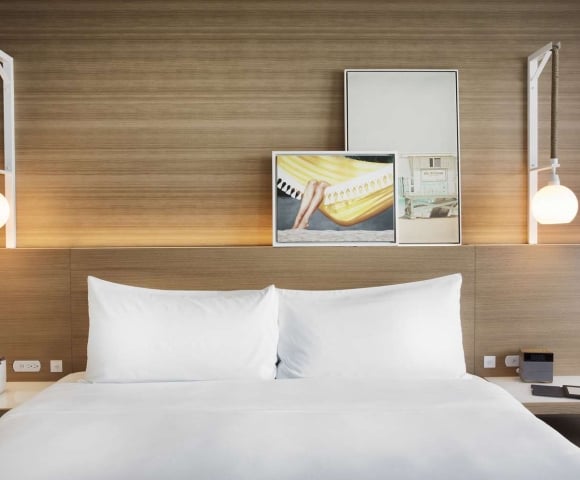 Sunrise King room with hanging pendant lights and modern art decor