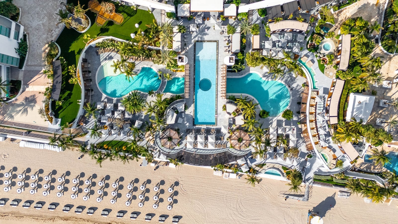 Aerial view of the Diplomat Resort featuring several outdoor pools, dining, and beachfront