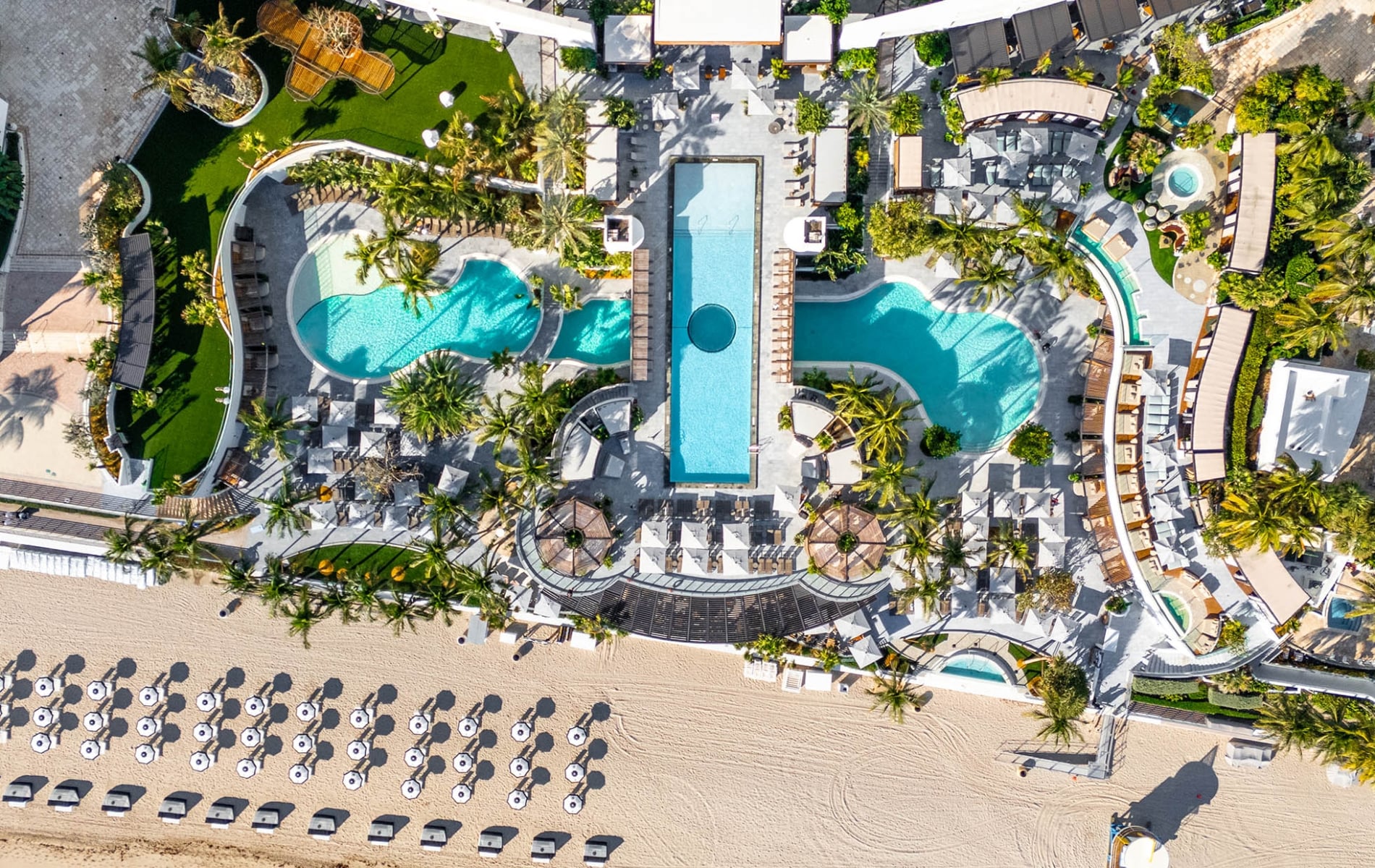 Aerial view of the Diplomat Resort featuring several outdoor pools, dining, and beachfront