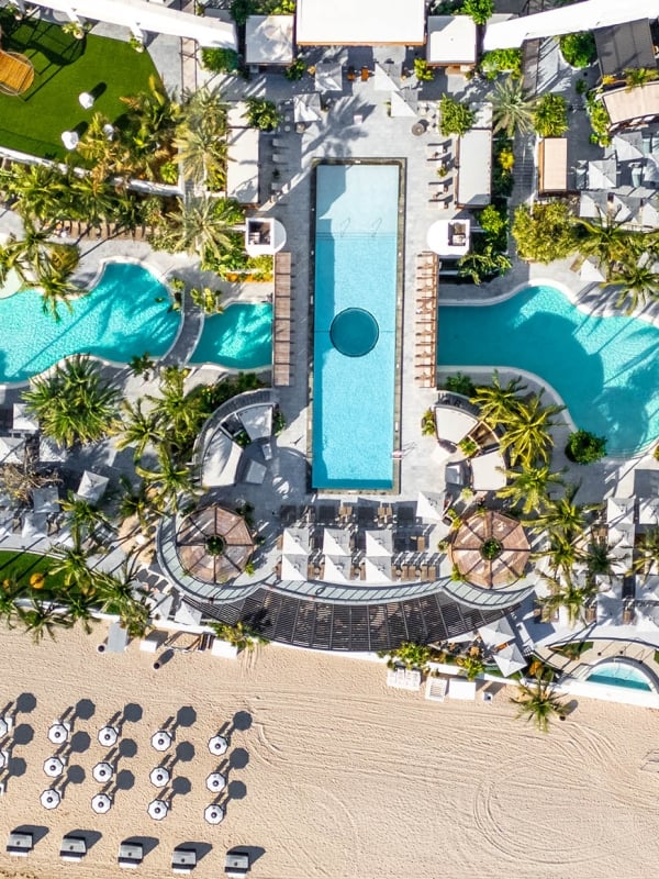 Aerial view of the Diplomat Resort featuring several outdoor pools, dining, and beachfront