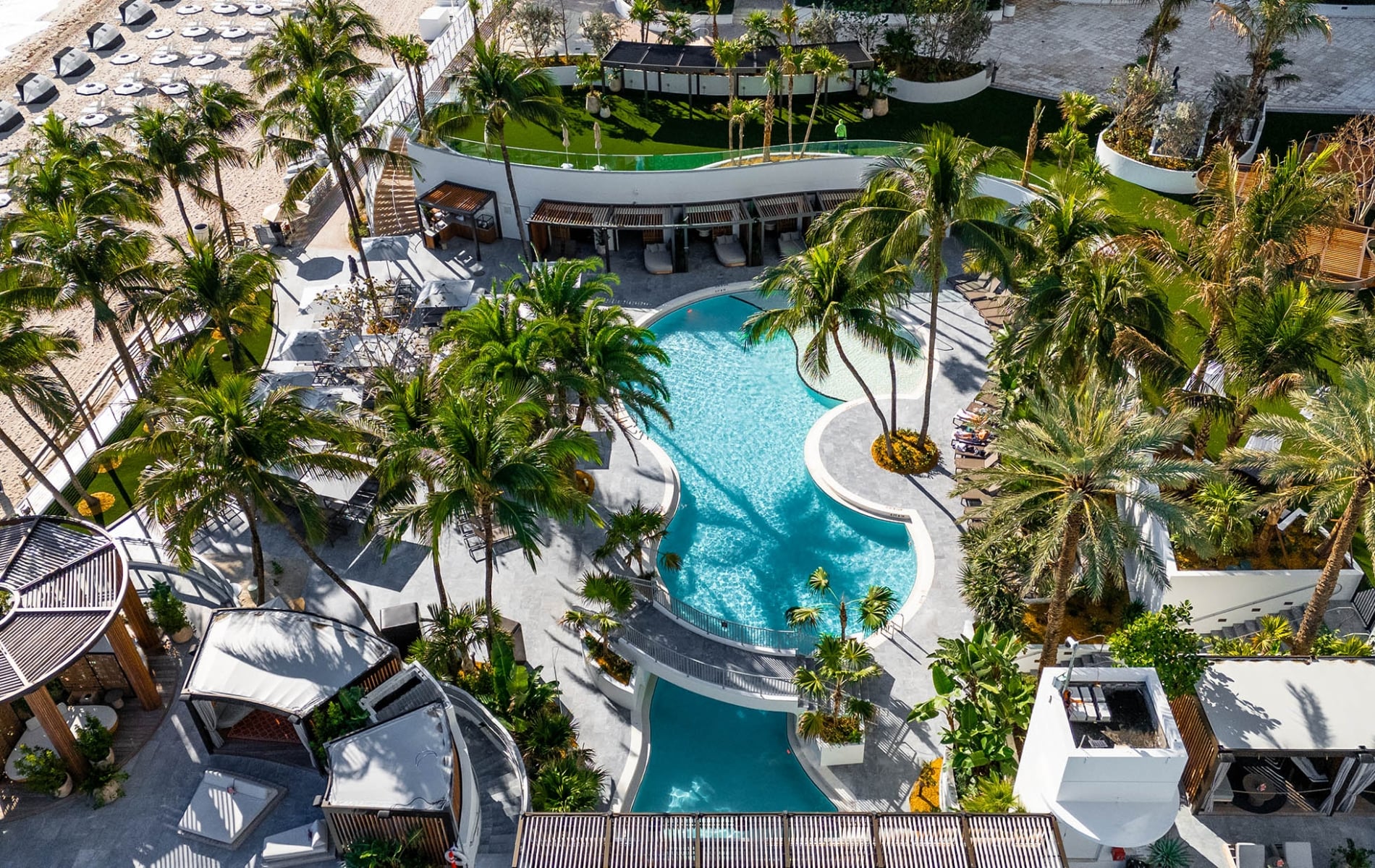 Aerial view of the lower lagoon pool surrounded by palm trees