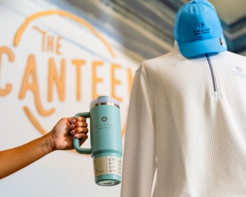 The canteen logo with mannequin and a water bottle