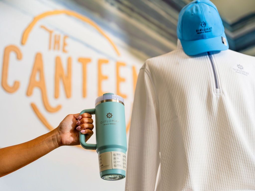 The canteen logo with mannequin and a water bottle