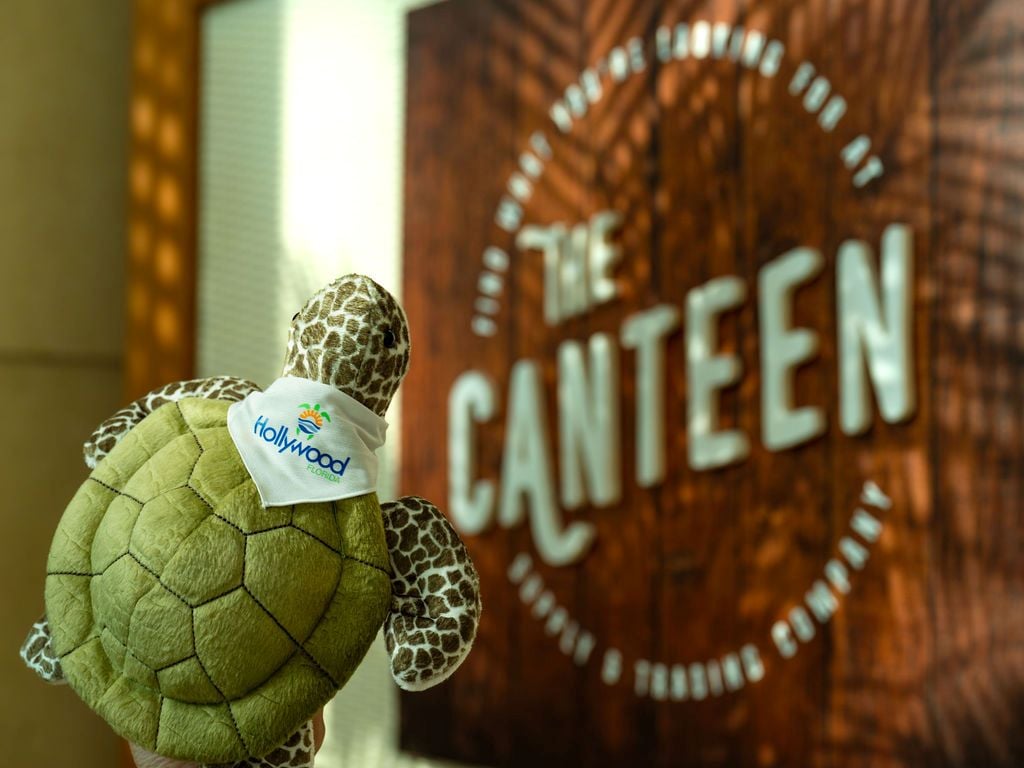 the canteen logo with stuffed turtle